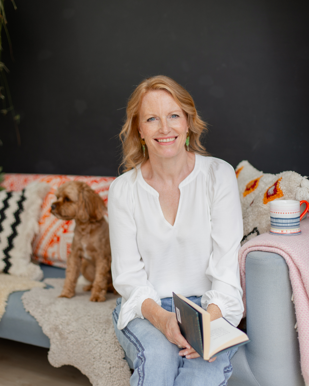 Helen Brooks, IBS specialist and founder of The Tummy Whisperer, sitting with her dog